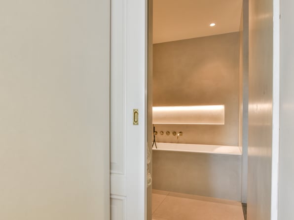A pocket door used for a bathroom in a stylish modern house.